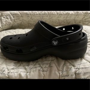 Size 6 black wedge crocs. Like new. Only worn a few times. Smoke free home.